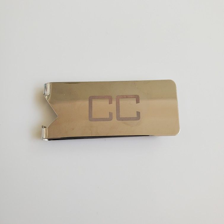 money clip/bottle opener
Initials "CC"