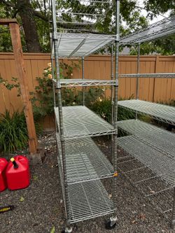 TRINITY EcoStorage 5-tier Wire Shelving Rack 48" x 24" x 72" NSF, one without wheels and one Includes Wheels