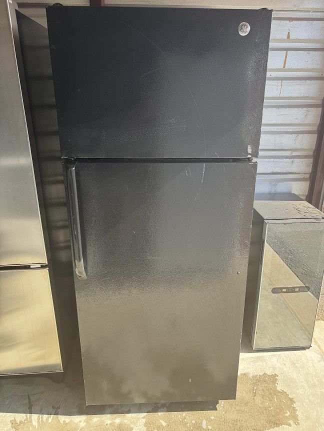 Black GE Refrigerator And Freezer