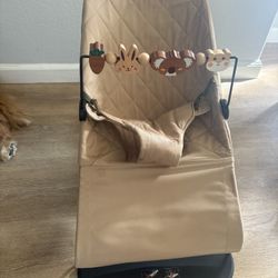 Baby Bjorn chair with new cover and toy bar