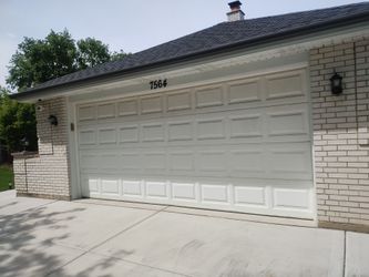 Used white 16x7 insulated raised panel garage door
