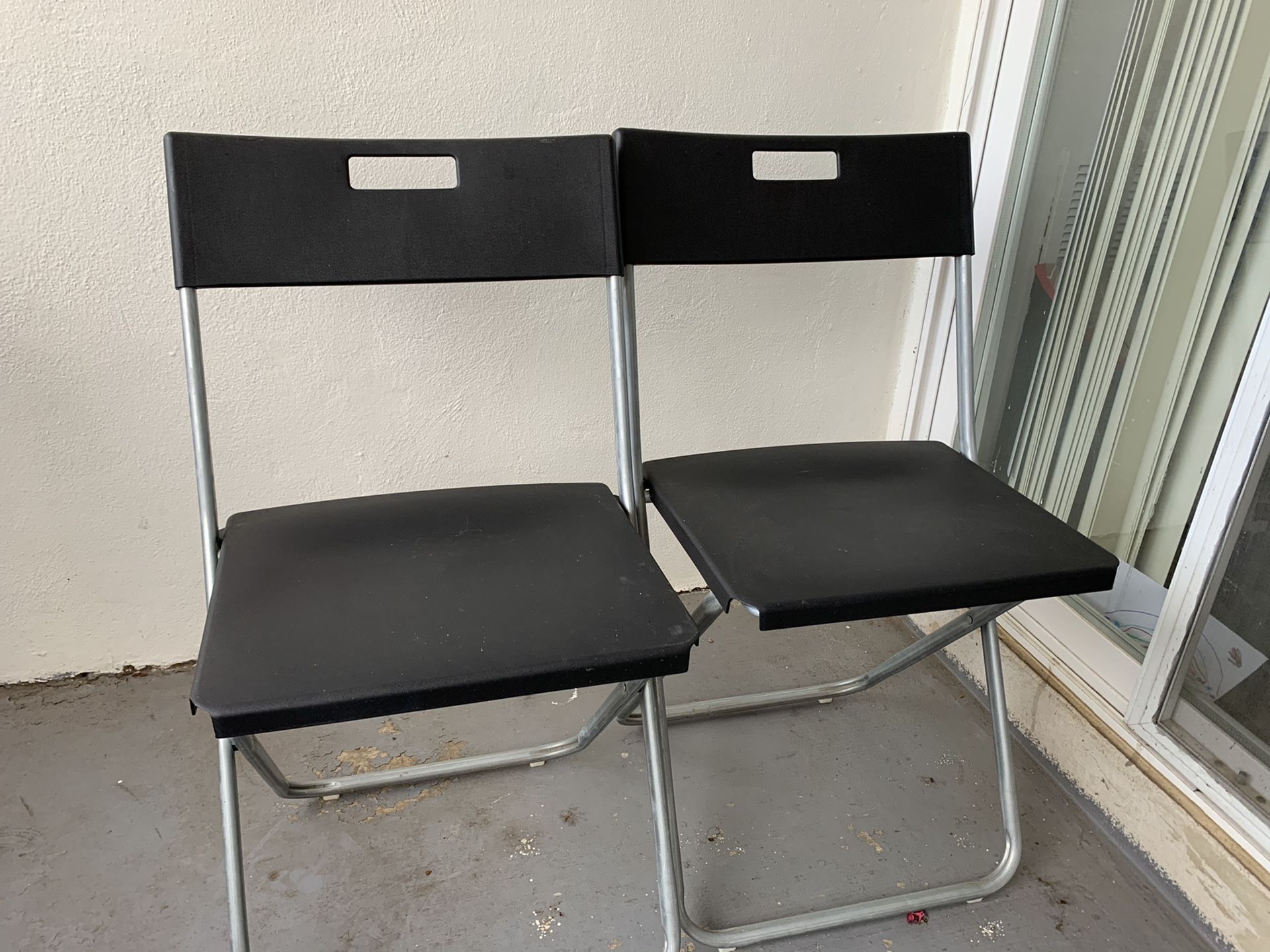 2 folding ikea chairs