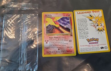 2000 Pokémon Black Star Promo Moltres (#21), featuring artwork by Toshinao Aoki.
I opened the package to reveal the card inside.  
I have a few sealed