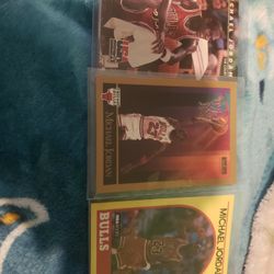 A Mixed Of Baseball And Basketball Cards 