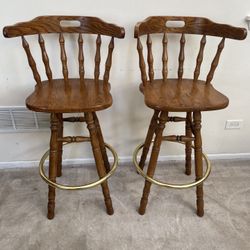  2 Vintage  Holland House Solidwood spindle back swivel bar stools with brass foot rings