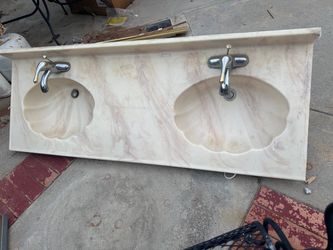Double sink counter top and faucet half shell look
