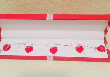Silver tone with red heart charms bracelet