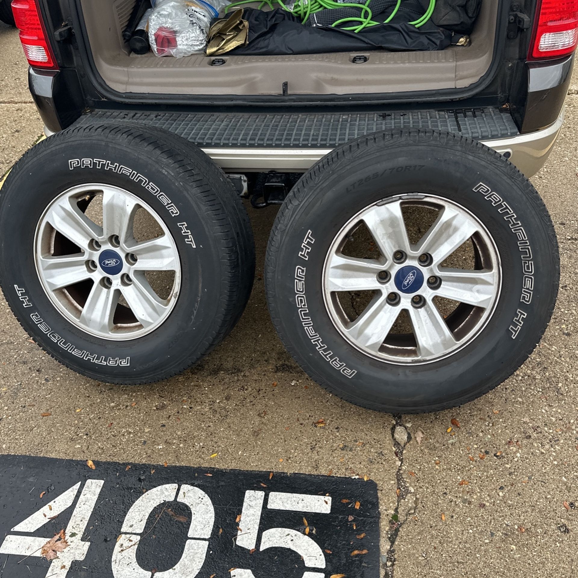 Two Ford truck tires with rims