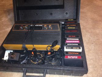 Atari in carrying case and 12 games rare