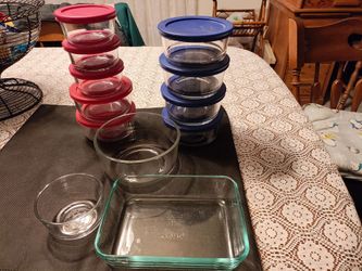 Glass bowls. All  9 on back have lids, 3 front don't  have lids. Some lids are discolored but still good