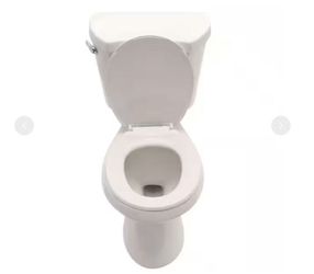 Glacier Bay 12 in. Rough In 2-Piece 1.28 GPF Single Flush Round Toilet in White, Seat Included - R