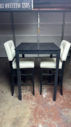 High top table and 2 chairs.