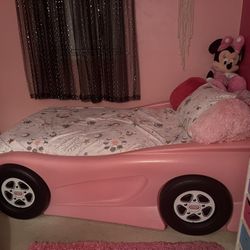 Pink car bed