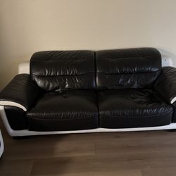 Black and white leather couches