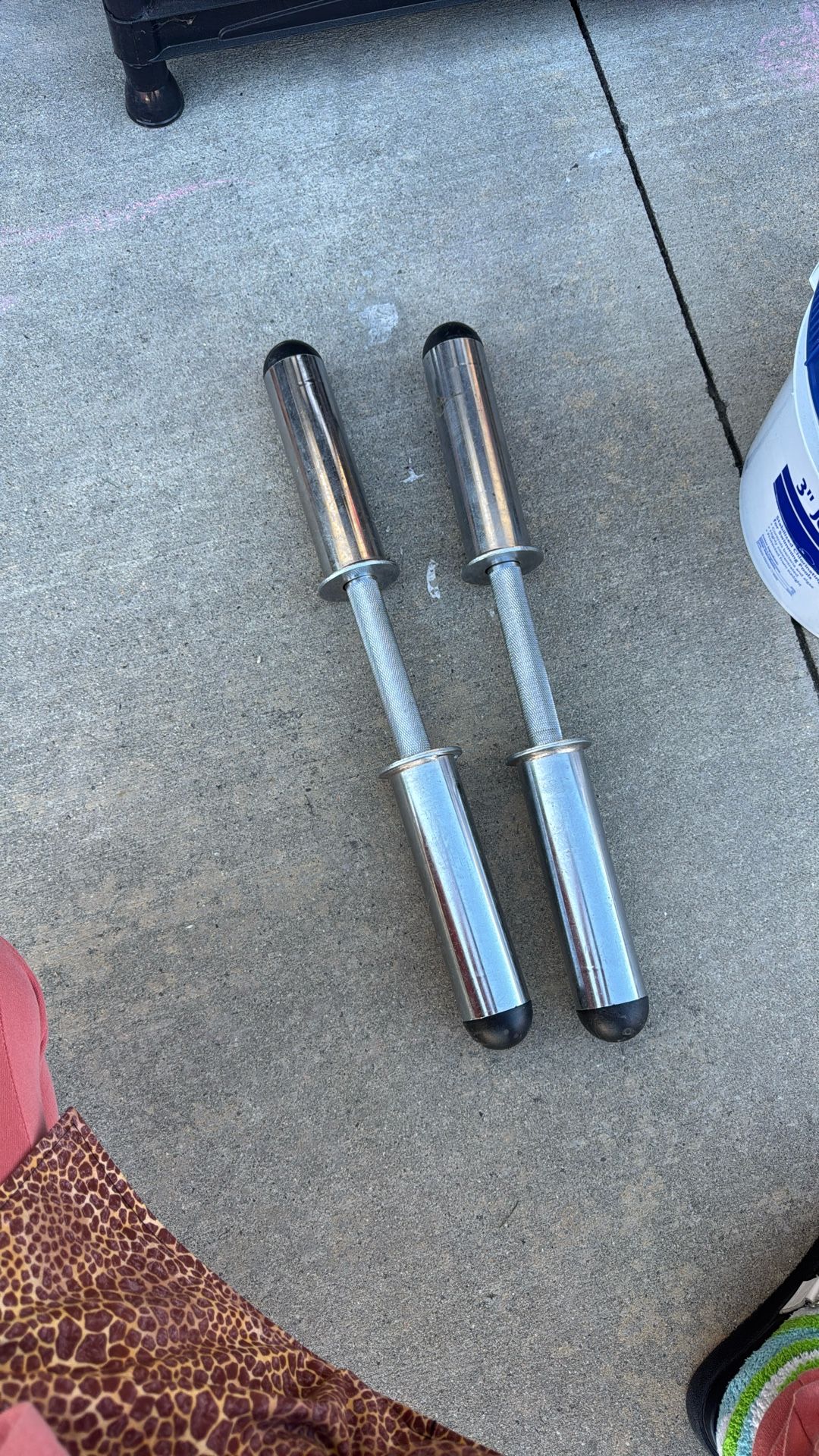 Olympic-style dumbbell handles.