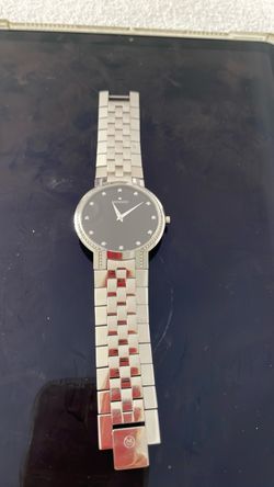 Movado men’s and women’s watch