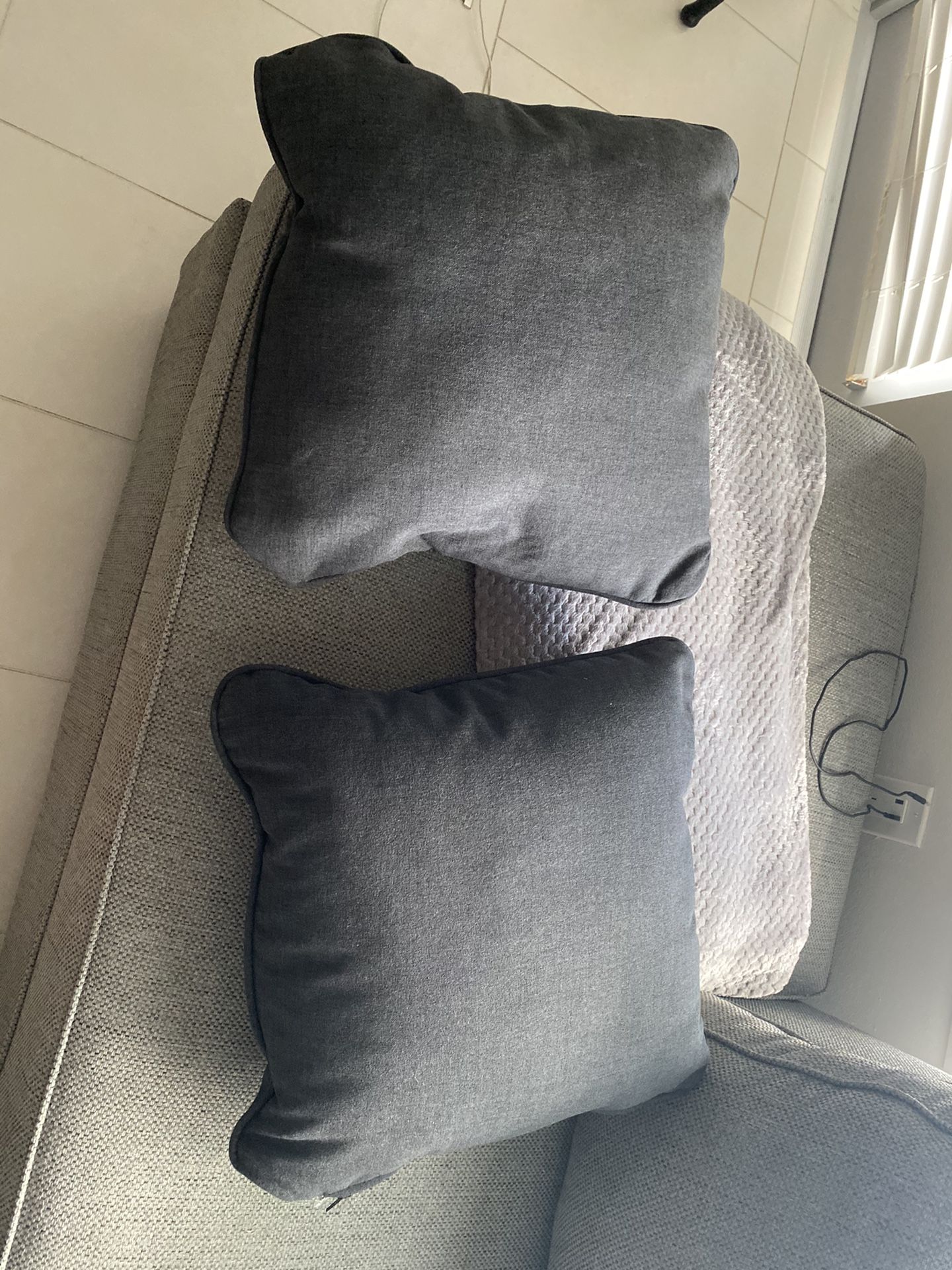2 dark grey brand new pillows