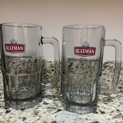 5 Sleemans beer glasses and 2 mugs