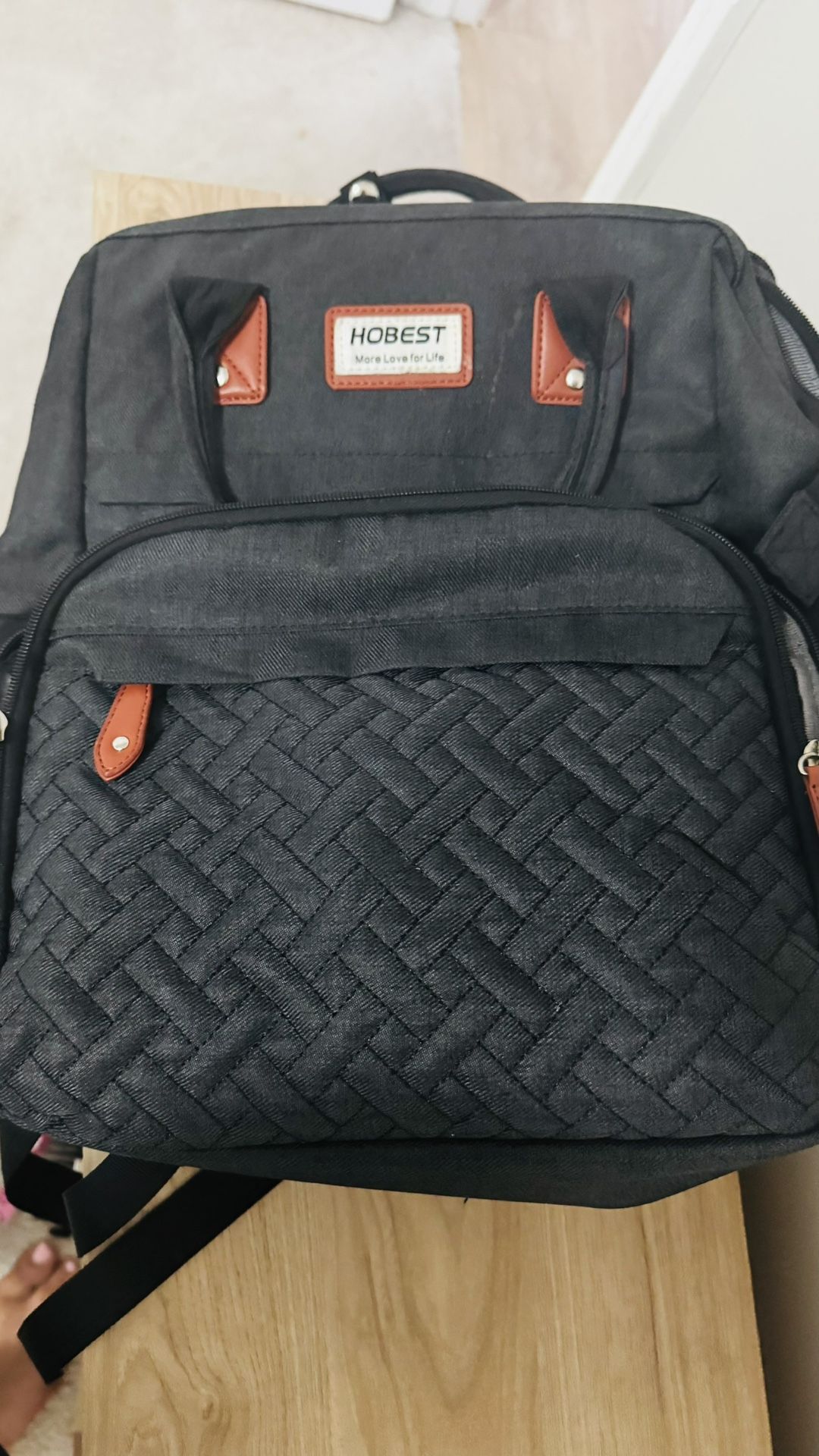 Diaper bag with diaper changing station