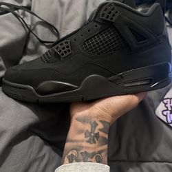 Black Cat Jordan 4’s