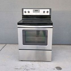 "WHIRLPOOL" STAINLESS ELECTRIC RANGE GLASS ON TOP WITH OVEN AND 5 BURNERS IN GOOD CONDITION 90 DAYS OF WARRANTY AND DELIVERY FREE