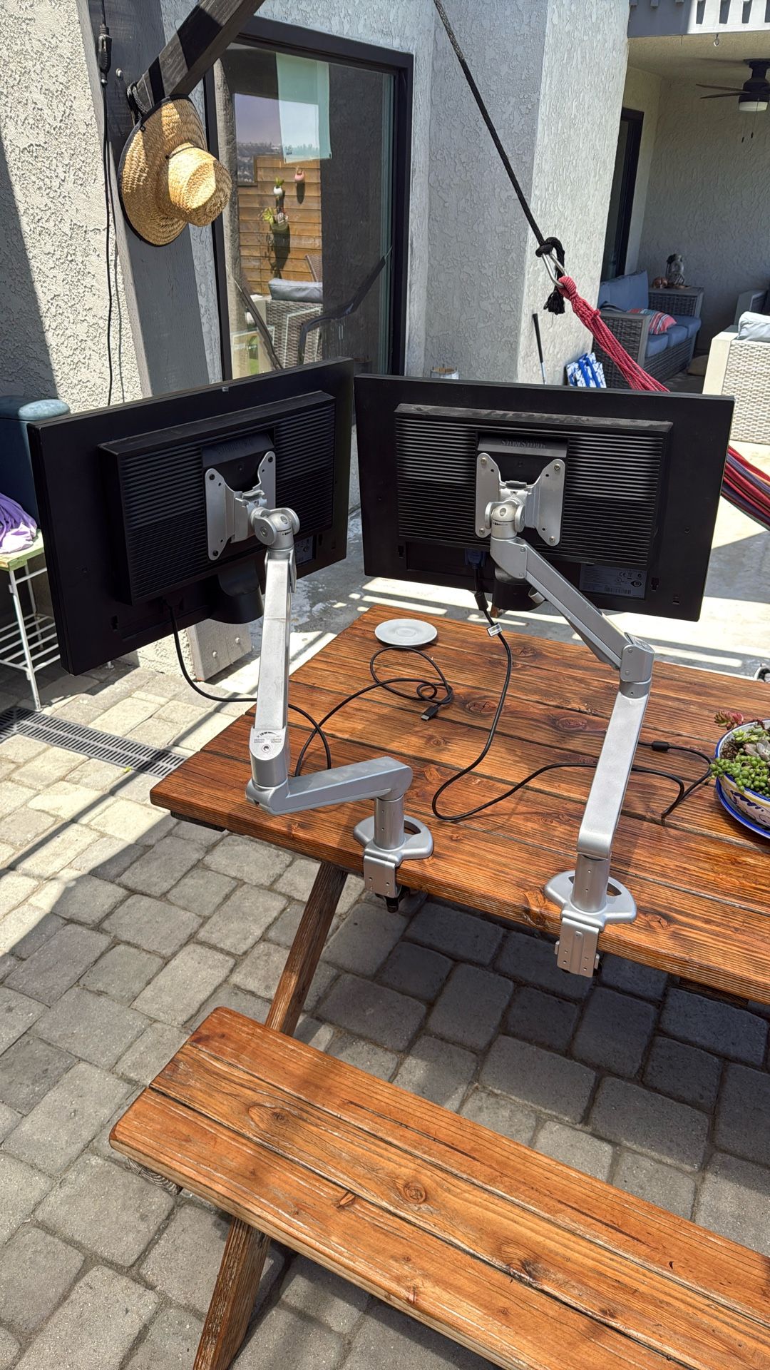 Pair Of Mounting Arms And Monitors