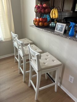 3 white chairs