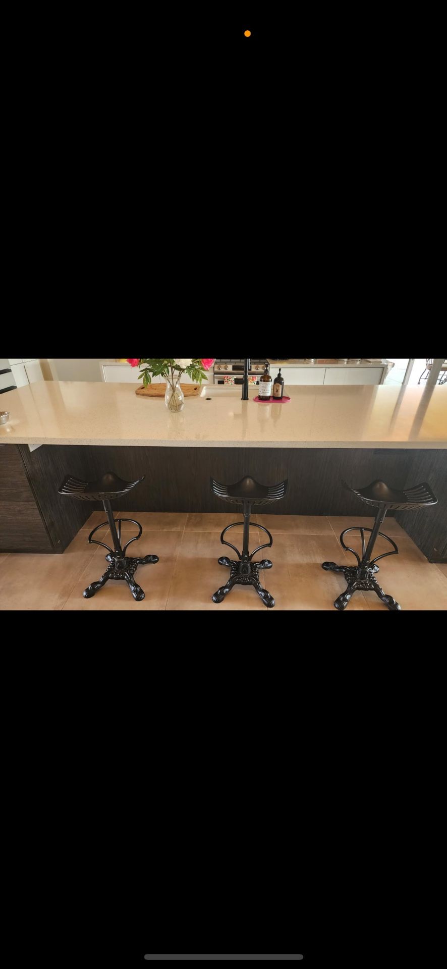 Three iron bar tractor barstools