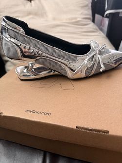 Asyllum Silver Pointed-Toe Heels with Bow