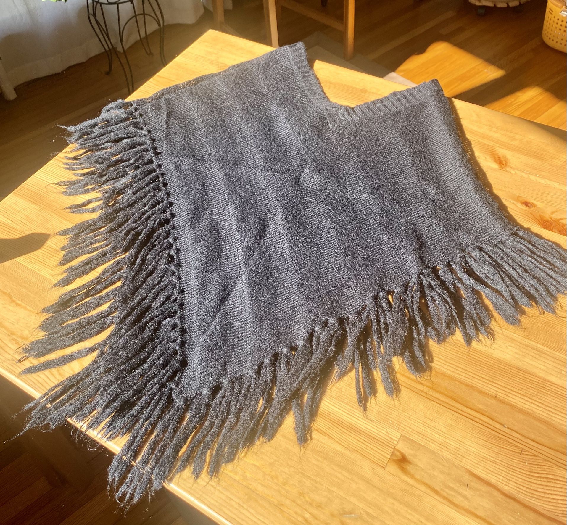 Black Fringe Cape; Bloomingdale’s