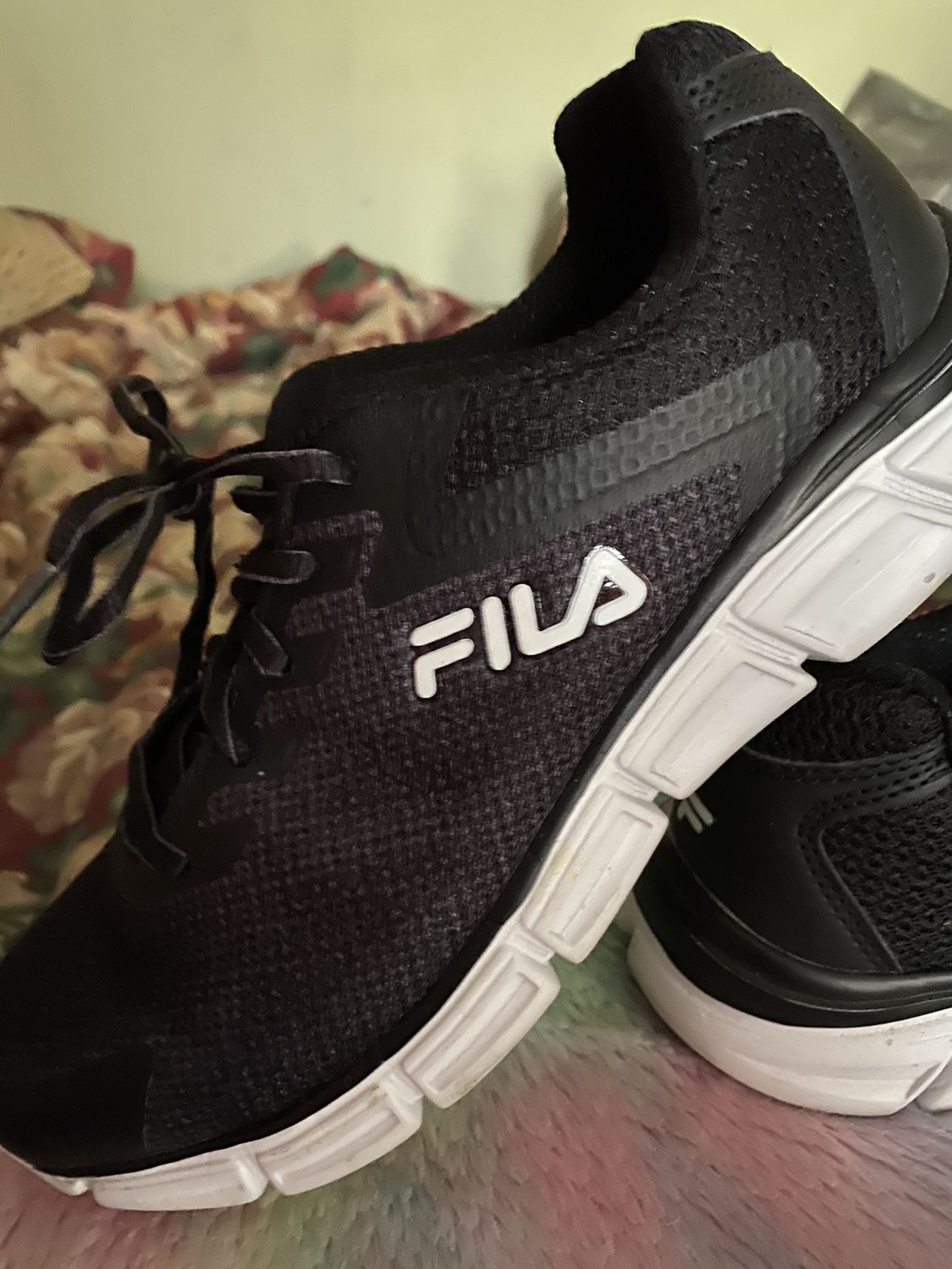 Women’s size 8 1/2. FILA running shoe