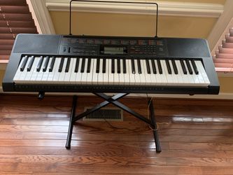Casio Keyboard with lighted keys and song bank
