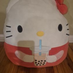 Girl Big Hello Kitty plushy pillow holding boba