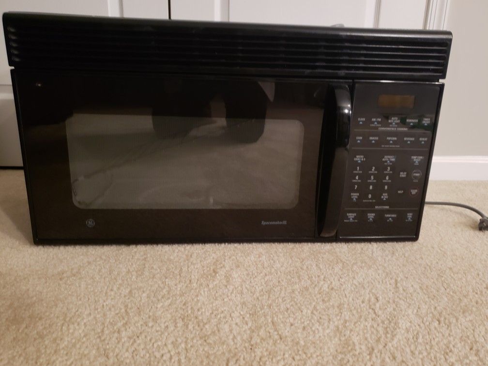 GE SpacemakerXL over the range microwave. (Height 16" x Length 30" x Depth 14")
