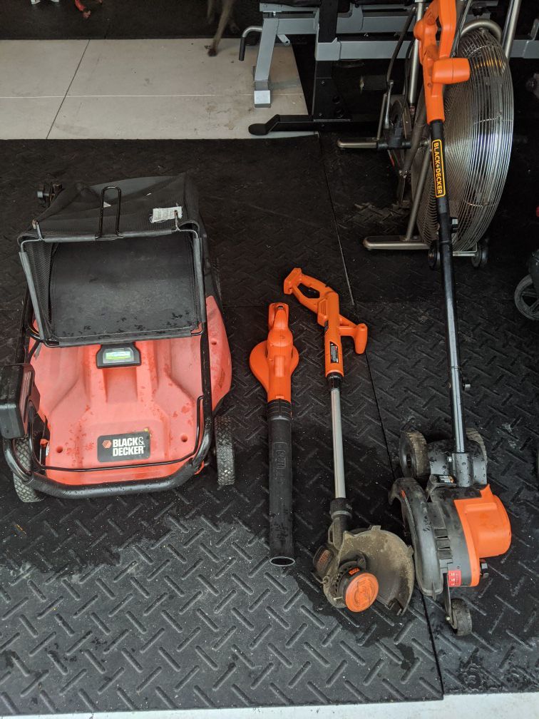 Black and Decker lawnmower, blower, weed whacker, and edger