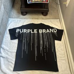 PURPLE BRAND SHIRT SIZE LARGE LEFT.