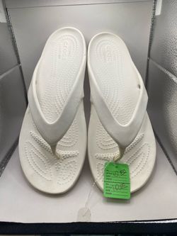 Size 9W, pair of white Crocs Women's Kadee II Flip sandals