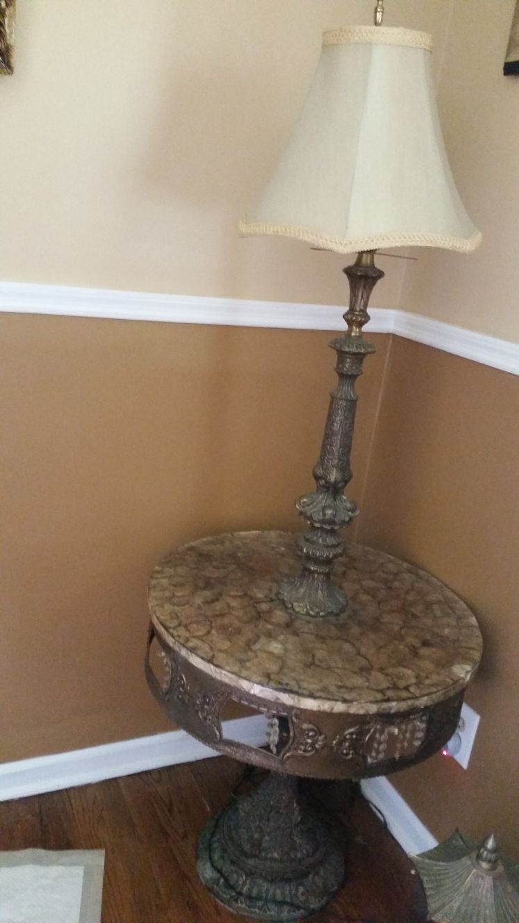 Beautiful antique table with lamp.