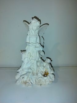 Angel Statue With Flowers And Flowers Basket