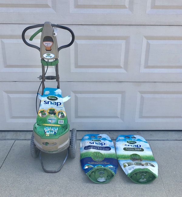 Scotts Snap System Spreader with 2 free Scotts snap bags for refill. For grass seed
