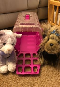 Stuffed cat, dog, and carrier