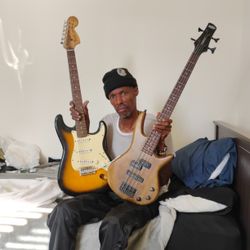 Fender Strat And Ibanez Bass Guitars 