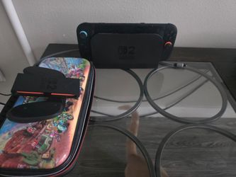 Nintendo switch 2 with mario kart world and screen protector  and extra controller