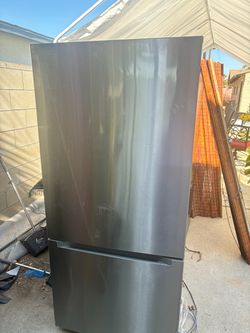 Black n gray fridge , semi new