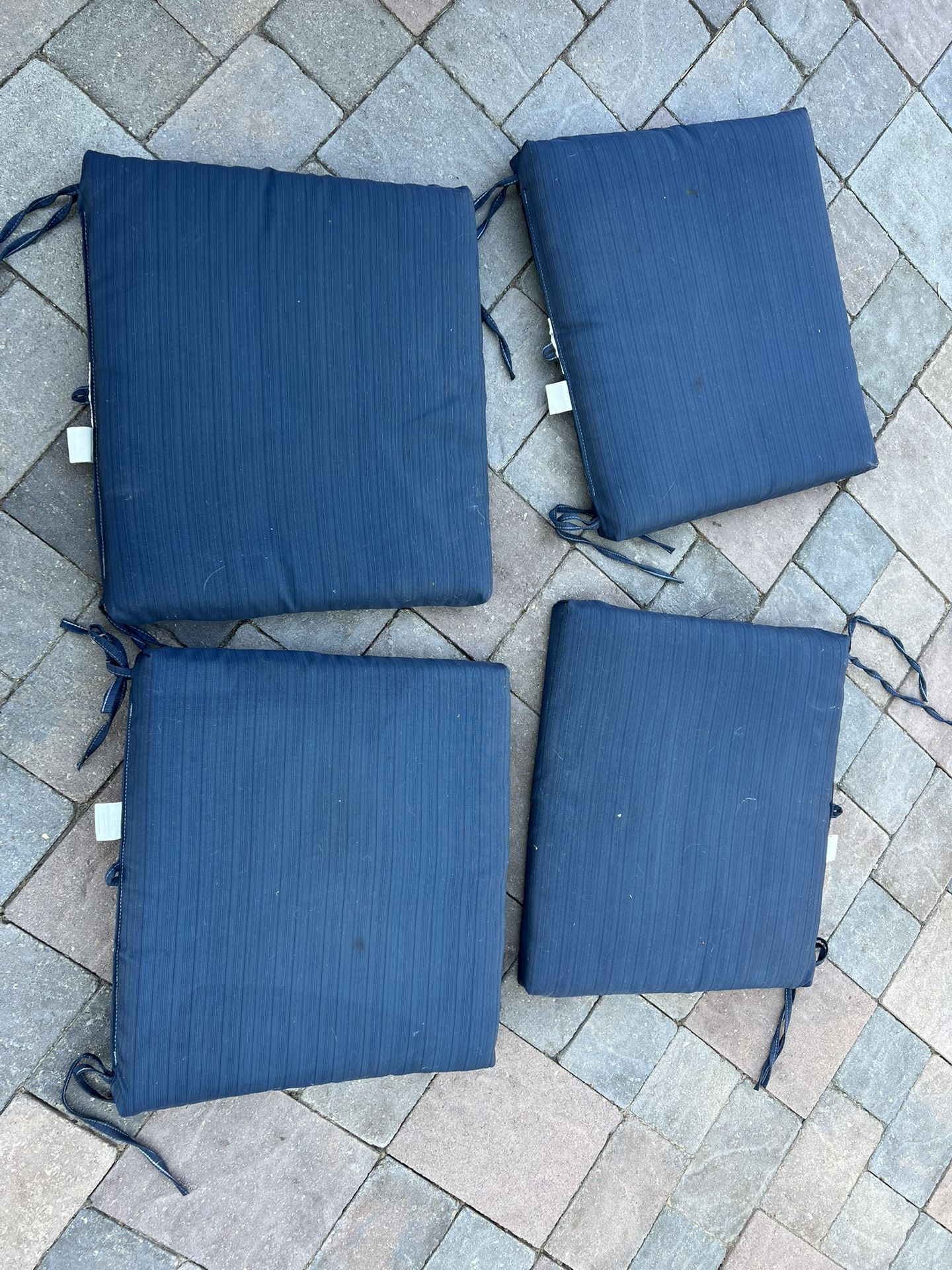 4 Piece Outdoor Patio Furniture Cushions in navy blue  Located in concord  Very good condition  No damages Covers not removable   Measures 17” x 19”  