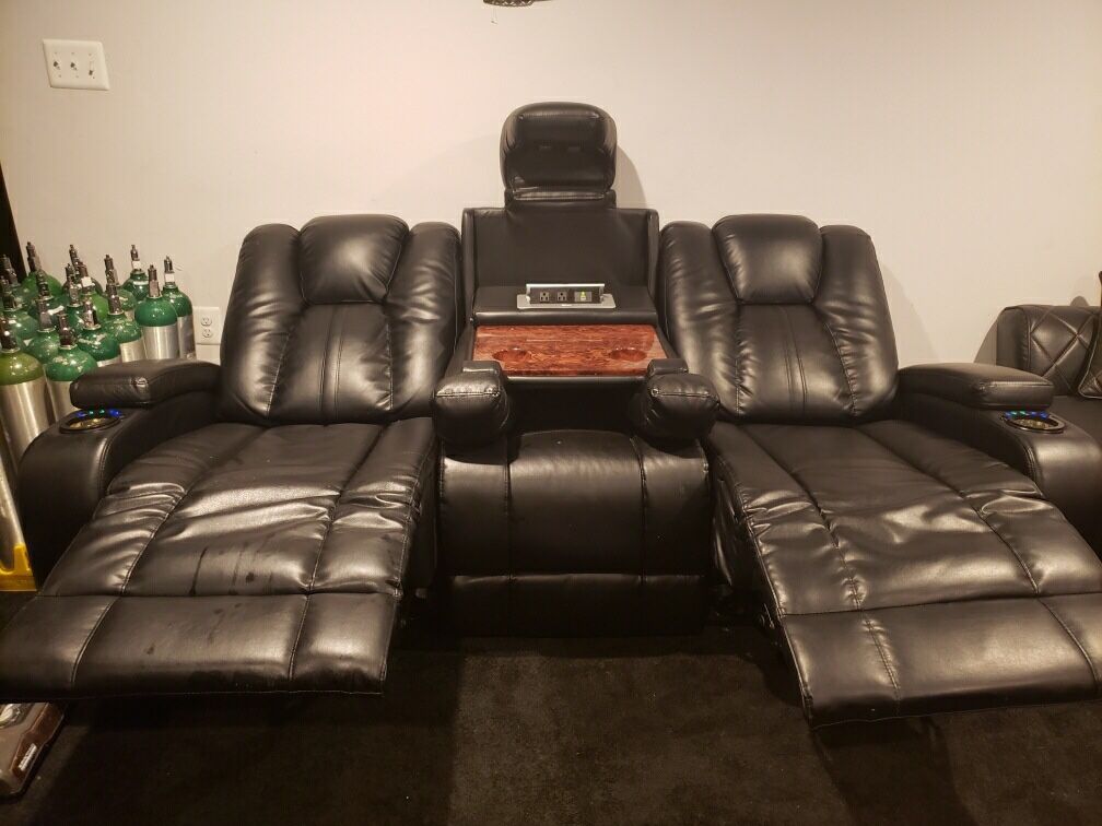 Electric recliner love seat and 2 Zebra chairs.