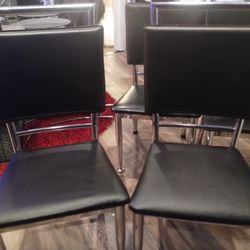 4 Black And Chrome Chairs 