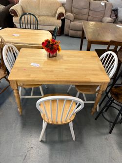 Light oak colored dining table and chairs (in store)