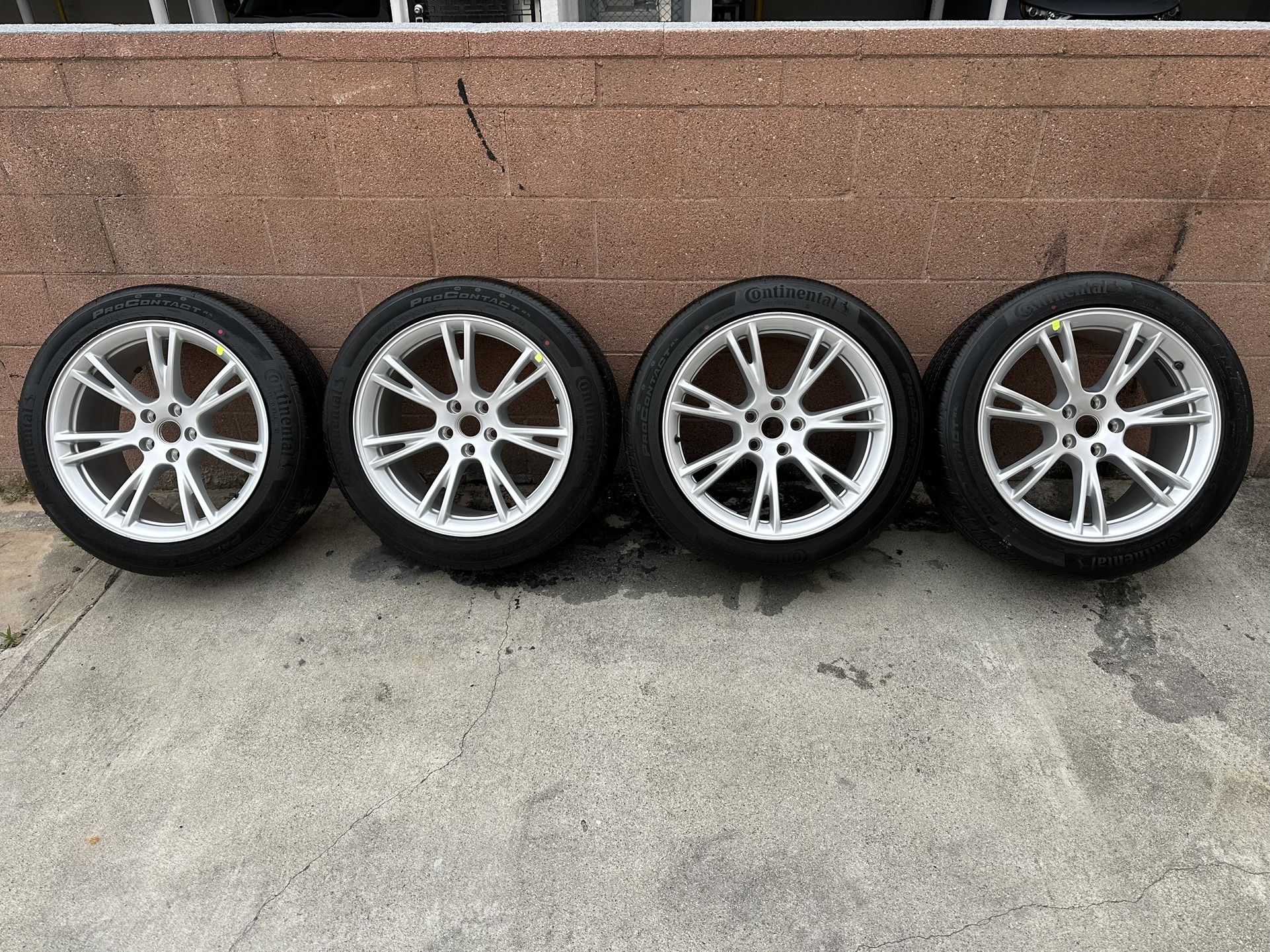 Tesla Model Y 19" OEM wheels and tires with TPMS.