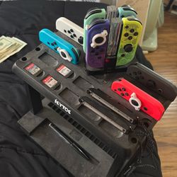 4 Pairs of Nintendo Joycons with Games and Assecories